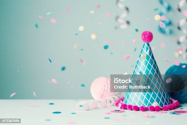 Party Hat And Falling Confetti Stock Photo - Download Image Now - Party Hat, Confetti, Pink Color