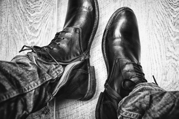 istock Mens leather shoes close-up, jeans. 673367770