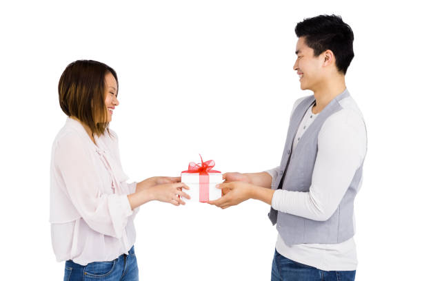 istock Young man giving a present to woman 673372452