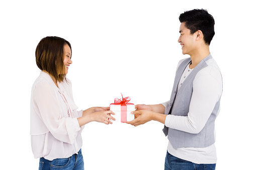 Young man giving a present to woman on white background