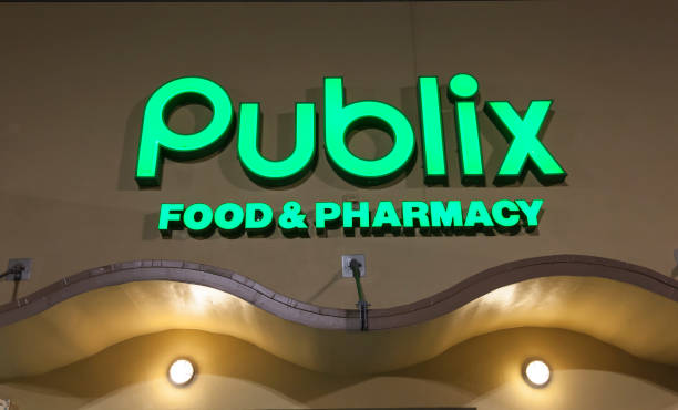 Miami, FL, USA - March 12, 2017: Publix food and pharmacy grocery store sign illuminated at night. Miami, Florida, United States
