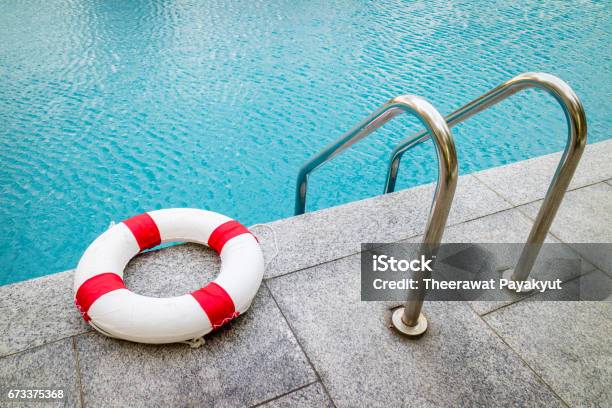 Life Ring At Swimming Poolemergency Tire Floating At Swimming Pool Stock Photo - Download Image Now