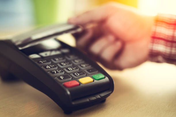 istock Man paying with NFC technology on credit card 673375796