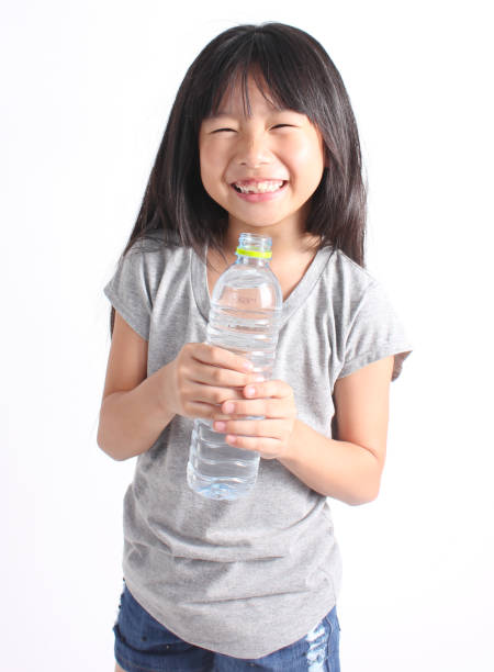 istock Young little girl drinking water 673379142