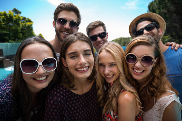 istock Happy friends posing for a selfie 673379354