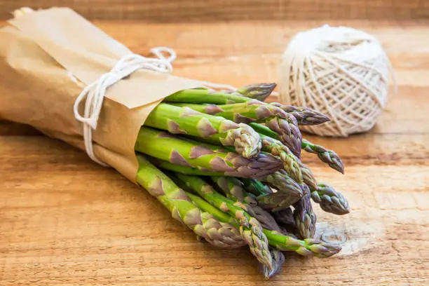 Asparagus.Green organic vegetables on wooden background