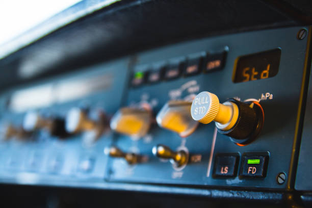 modern airliner autopilot instrument panel and controls. flight control unit (fcu) with knobs, dials and buttons. - cockpit airplane autopilot dashboard imagens e fotografias de stock