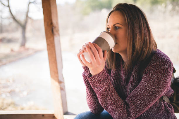 istock Hiker woman resting drinking coffee 673388166