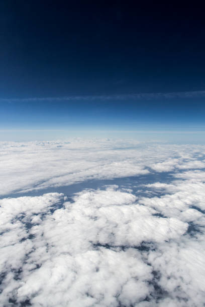 istock Cloudy skies over europe pictured from high altitude with deep blue skies. 673388978