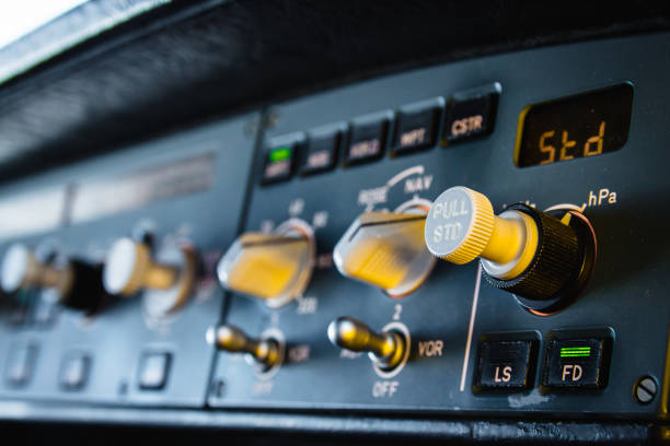 modern airliner autopilot instrument panel and controls. flight control unit (fcu) with knobs, dials and buttons. - cockpit airplane autopilot dashboard imagens e fotografias de stock