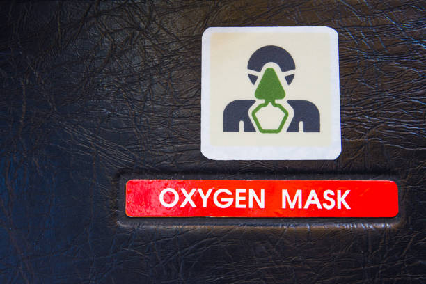 Oxygen mask warning label in a modern airliner cockpit. Used in emergency cases for supplying emergency oxygen supply. stock photo