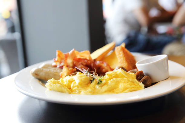 Fried eggs sunny side up with bacon breakfast at the restaurant