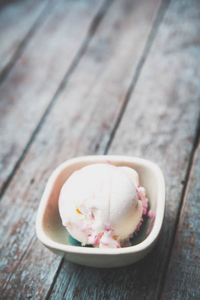 istock Berry ice cream on wood background 673397930