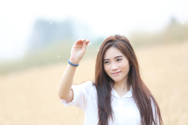 Asian girl on wheat field