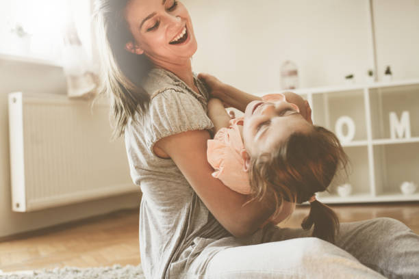 istock Single mother with her daughter at home. 673404330