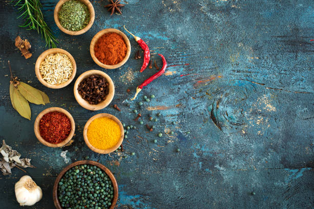 istock Spices and herbs on wooden background 673411194