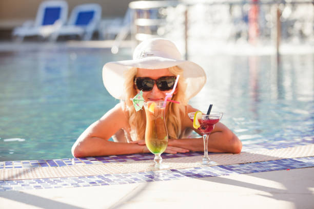 istock Woman in swimming pool 673414016