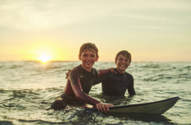istock There's nothing better than catching some waves with a friend 673414070