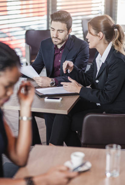 istock Business People Having a Meeting in a Cafe Restaurant 673417746
