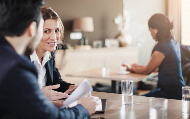 istock Business People Having a Meeting in a Cafe Restaurant 673417792