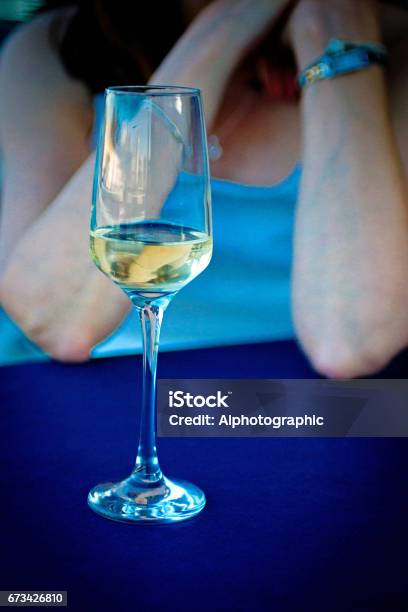 White Wine Glass On A Street Cafe Table Stock Photo - Download Image Now - Chablis Wine, Adult, Alcohol - Drink