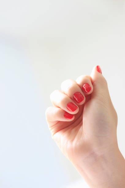 istock Women's Red Nail Polish 673431172