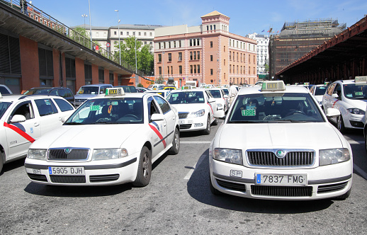 MADRID, SPAIN - May 10, 2012: Lots of white taxis near Atocha train station in Madrid