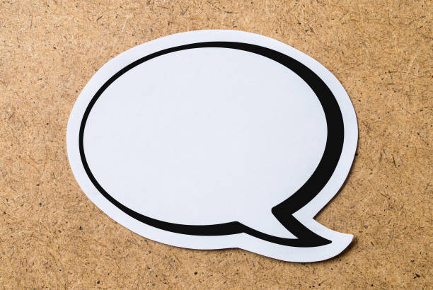 istock Large blank speech bubble on a light brown wooden cork board background. Chat bubble cut from paper and cardboard. Message, chat and communication concept. 673437054