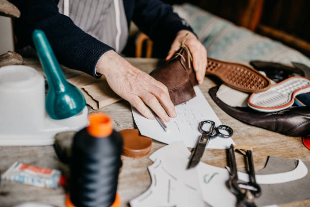 istock Close up of a cobbler making a shoe for men 673442166