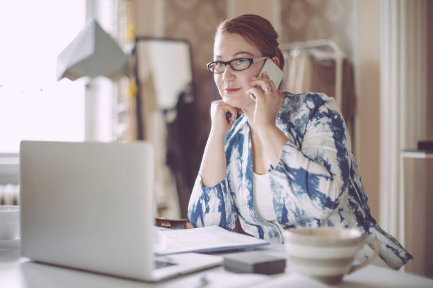 istock Businesswoman working in her studio 673442710