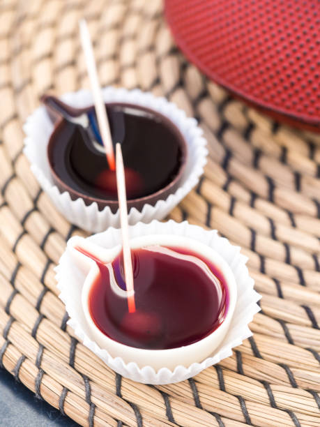 Ginja de Obidos, traditional Portuguese sour cherry liquor Ginja de Obidos, traditional sour cherry liquor, served in small cups made of chocolate. obidos photos stock pictures, royalty-free photos & images