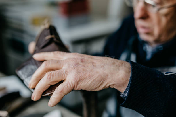 istock Close up of a shoemaker working at the workshop 673442914