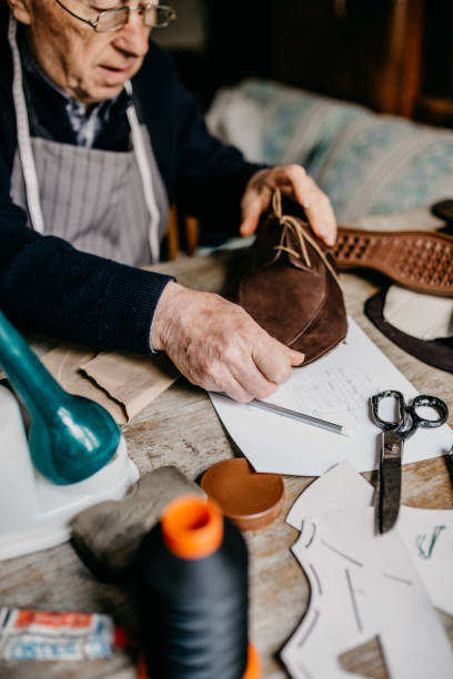 Senior cobbler working hard at the shop