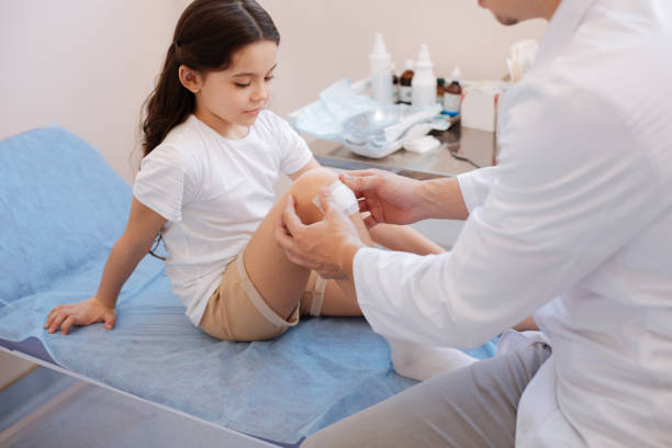istock Cute young girl having an injury 673464166