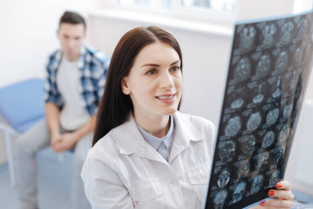 istock Cheerful delighted doctor smiling 673474452