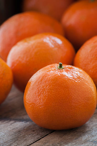 istock Fresh mandarins on a wooden board. 673474830
