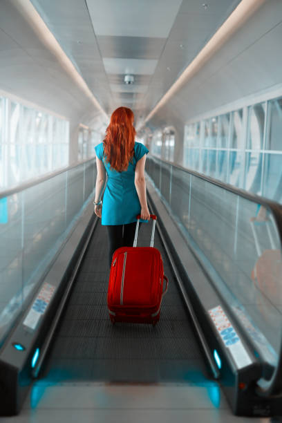 istock woman going to catch her flight 673478752