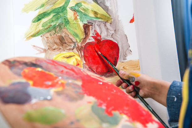 istock Little artist painting 673478942