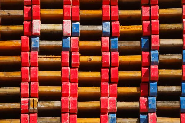 Stacked wooden boards on a construction site