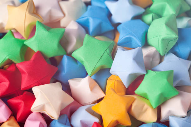 istock Colorful origami lucky stars background 673480816