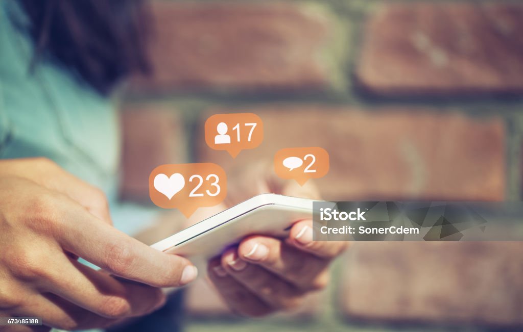 Young girl using smart phone,Social media concept. Social Media Stock Photo