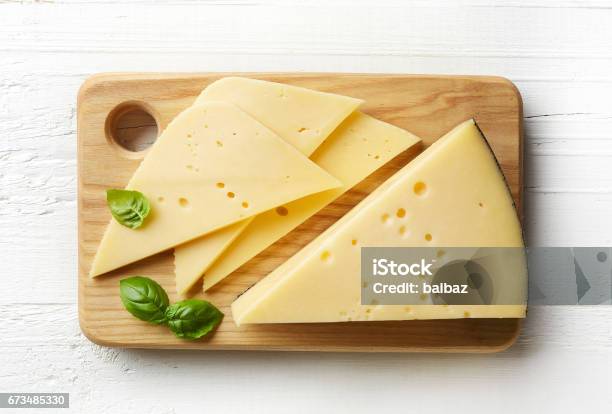 Piece And Slices Of Cheese Stock Photo - Download Image Now - Cheese, High Angle View, Cutting Board