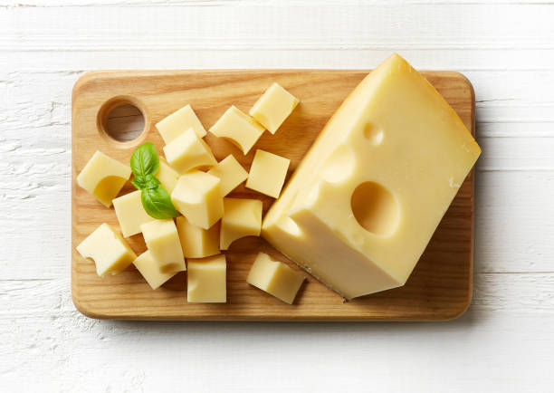 istock Piece and cubes of swiss cheese 673485362