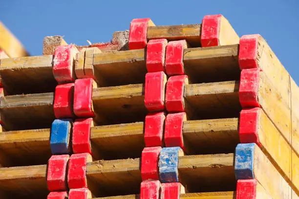 Stacked wooden boards on a construction site