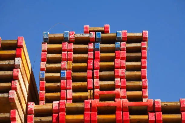 Stacked wooden boards on a construction site