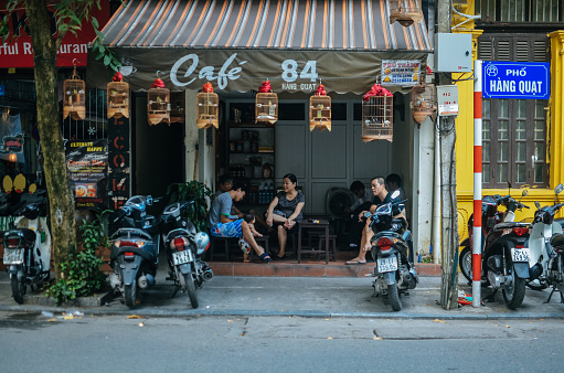 Hanoi, Vietnam - 8 October 2016: The local people having their coffee at these little small cafe shop at every old quarter street.