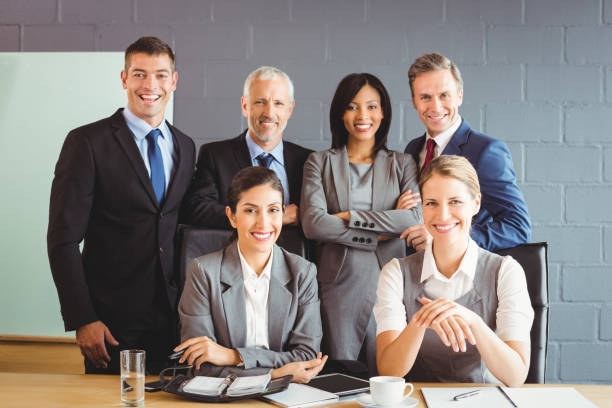 istock Businesspeople smiling in conference room 673489820