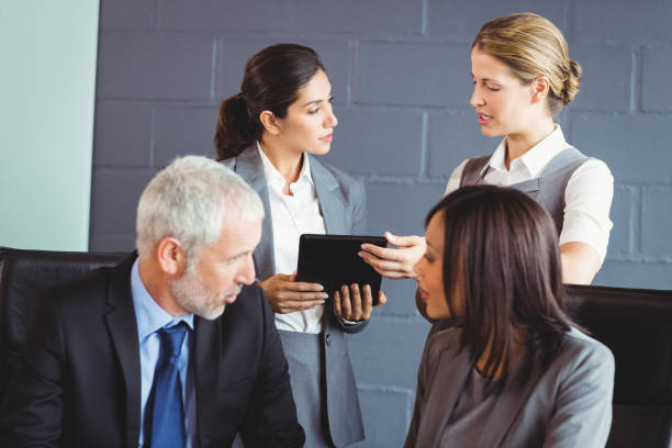 istock Businesspeople interacting in conference room 673492666