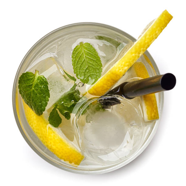 Glass of soda drink with lemon slices and mint isolated on white background. From top view