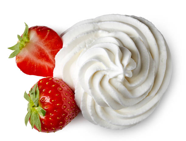 Whipped cream and strawberries Whipped cream and strawberries isolated on white background. From top view whipped food stock pictures, royalty-free photos & images
